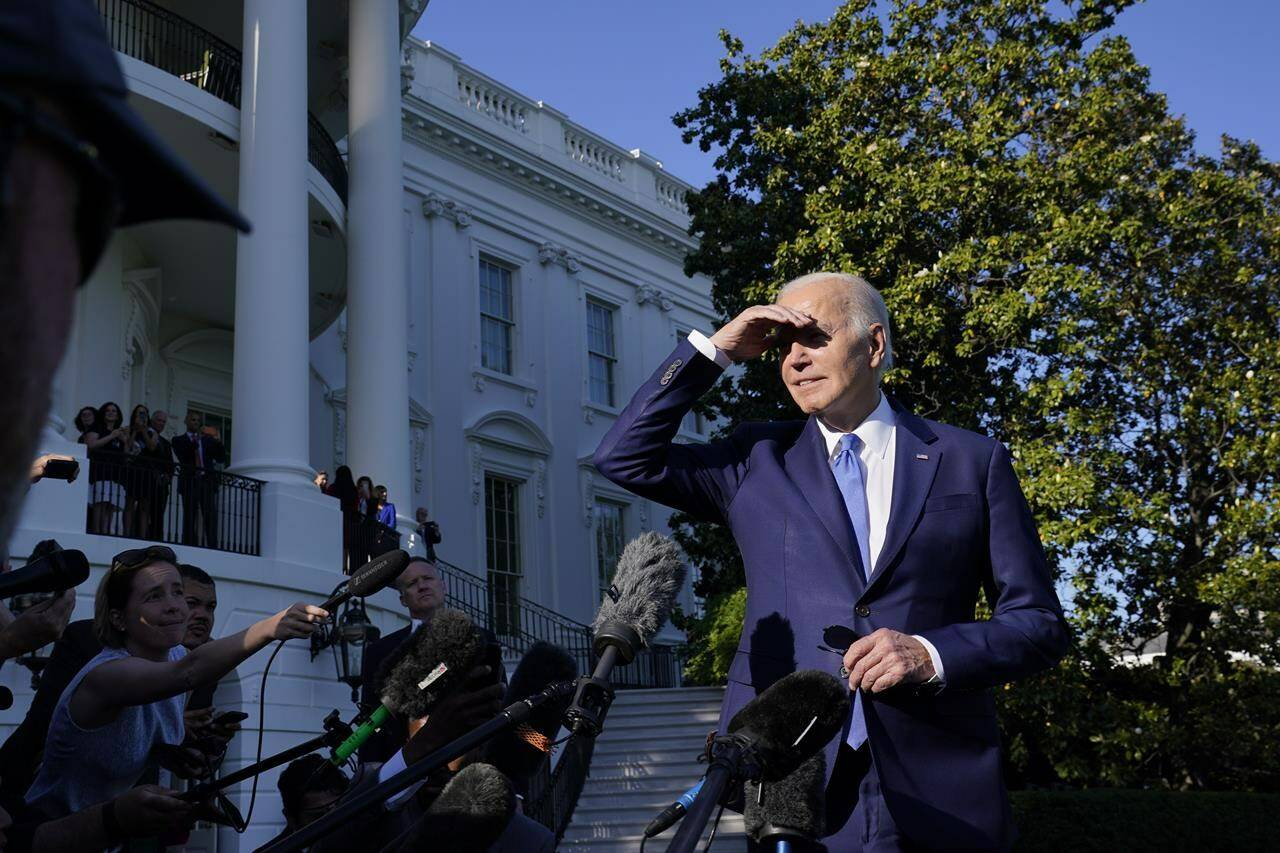 President Joe Biden talks with reporters on the South Lawn of the White House in Washington, Friday, May 26, 2023, as he heads to Camp David for the weekend. (AP Photo/Susan Walsh)