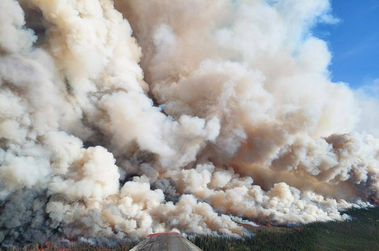 The Donnie Creek wildfire (G80280) burns in an area between Fort Nelson and Fort St. John, B.C. in this undated handout photo. The Peace River Regional District issued a new evacuation order as well as an alert Sunday in response to two wildfires burning in northeastern British Columbia. (BC Wildfire Service photo)