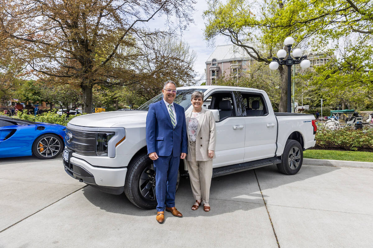 Blair Qualey, from the New Car Dealers Association of B.C., and Josie Osborne, Minister of Energy, Mines and Low Carbon Innovation, marked EV Day at the Legislature in May. NCDA photo
