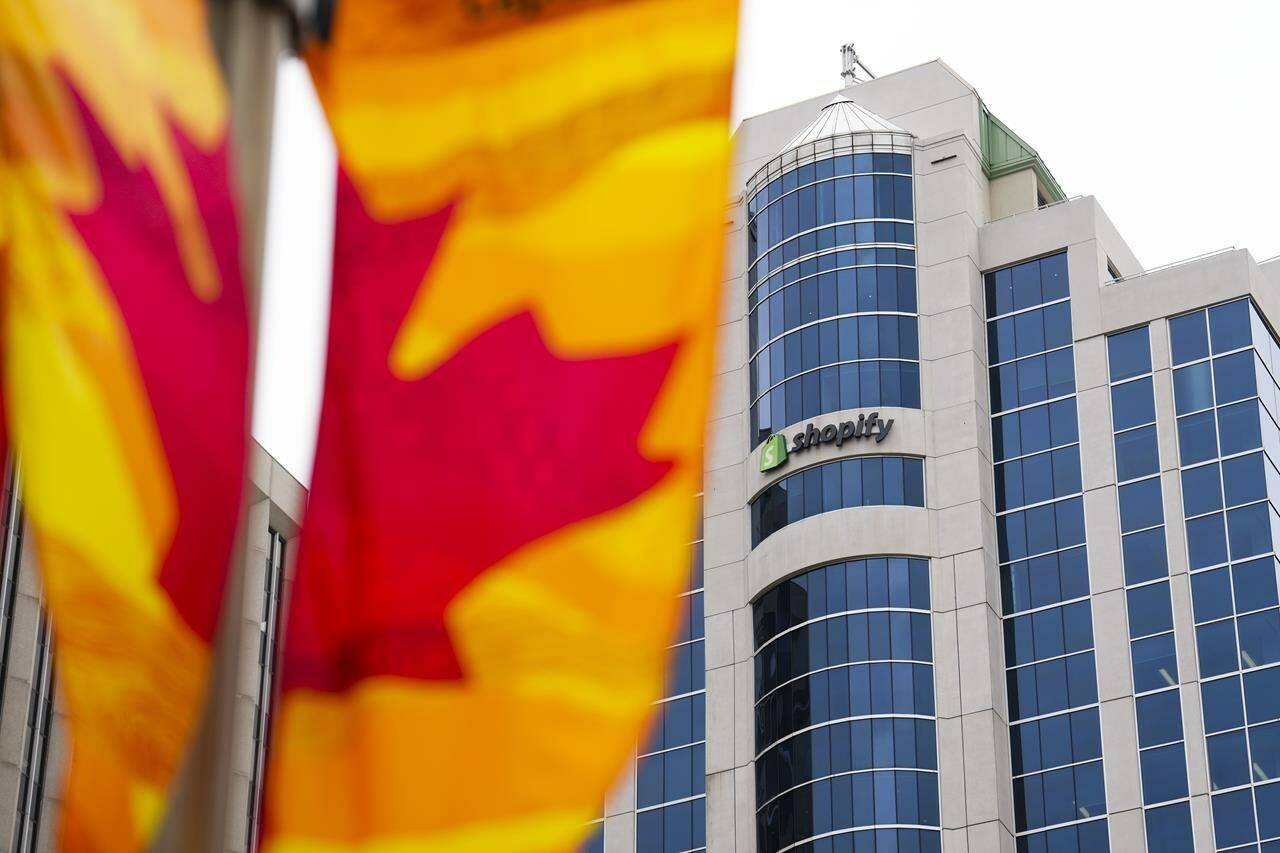 A class-action lawsuit alleges Shopify Inc. reneged on a deal it offered employees laid off in a recent round of cuts. Shopify Inc. headquarters signage in Ottawa on Tuesday, May 3, 2022. THE CANADIAN PRESS/Sean Kilpatrick