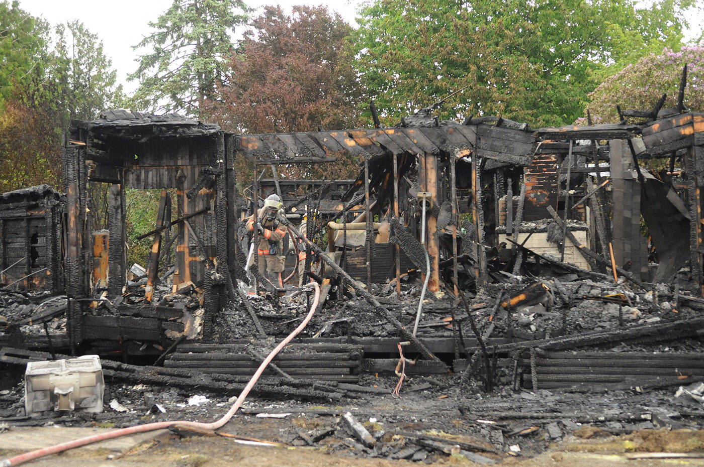 The house where Daniel Hackl allegedly engaged in an hours-long standoff with RCMP on Victoria Day burned to the ground the same night he was arrested. Hackl has made one strange court appearance and refused to appear for another since being detained. (Jenna Hauck/ Chilliwack Progress)