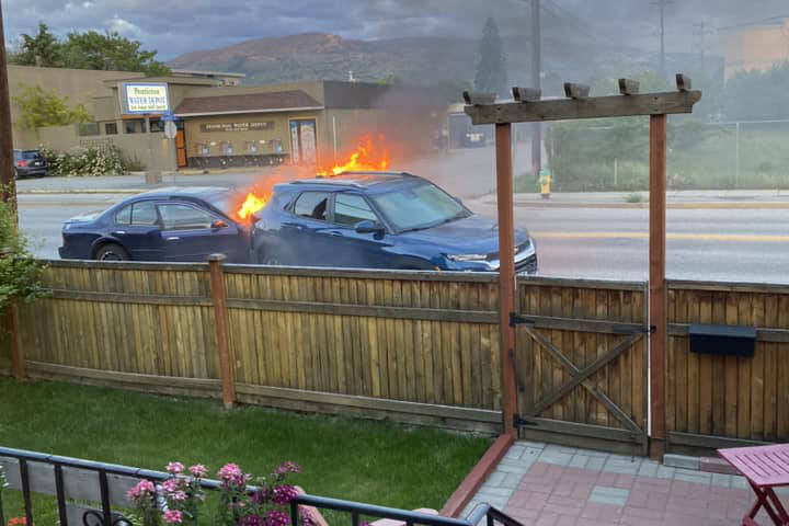 A 22-year-old woman who police said failed a breathalizer and admitted to police that she drove her Nissan into a parked car which caused both cars to catch fire on Monday night in Penticton’s Westminster Ave W. (Deb Antonick Facebook)