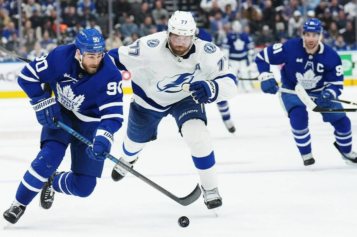 Toronto Maple Leafs forward Ryan O’Reilly (90) protects the puck from Tampa Bay Lightning defenceman Victor Hedman (77) during second period NHL Stanley Cup playoff hockey action in Toronto on Thursday, April 27, 2023. O’Reilly is one of the names poised to hit the free agency market. THE CANADIAN PRESS/Nathan Denette