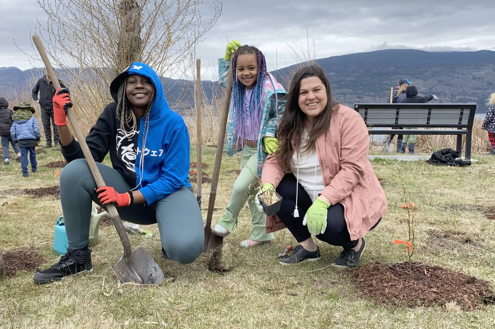 From left, Delphina Addo, 14; Malaika Owoka, six and Megan Brown were among those planting an Earth Day event in Summerland in 2023. (Black Press file photo)