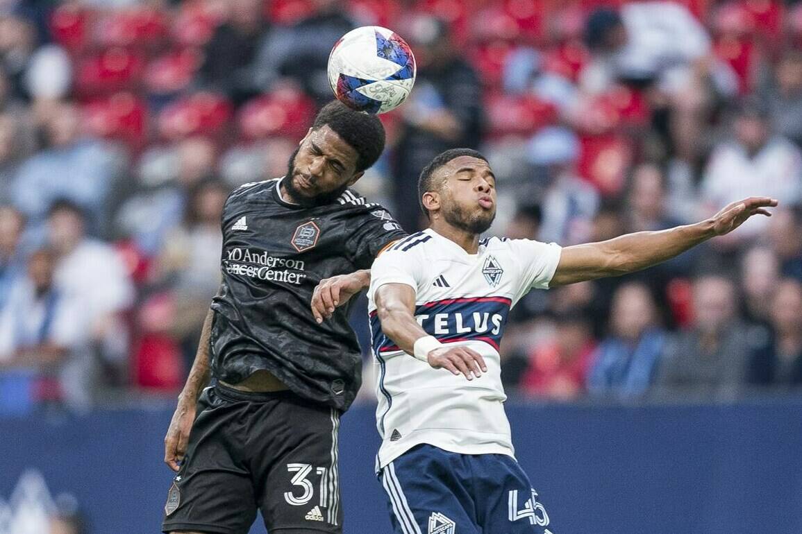 Vancouver Whitecaps FC’s Pedro Vite, right, battles with Houston Dynamo FC’s Micael battle for the ball during first half MLS soccer action in Vancouver, B.C., Wednesday, May 31, 2023. THE CANADIAN PRESS/Rich Lam