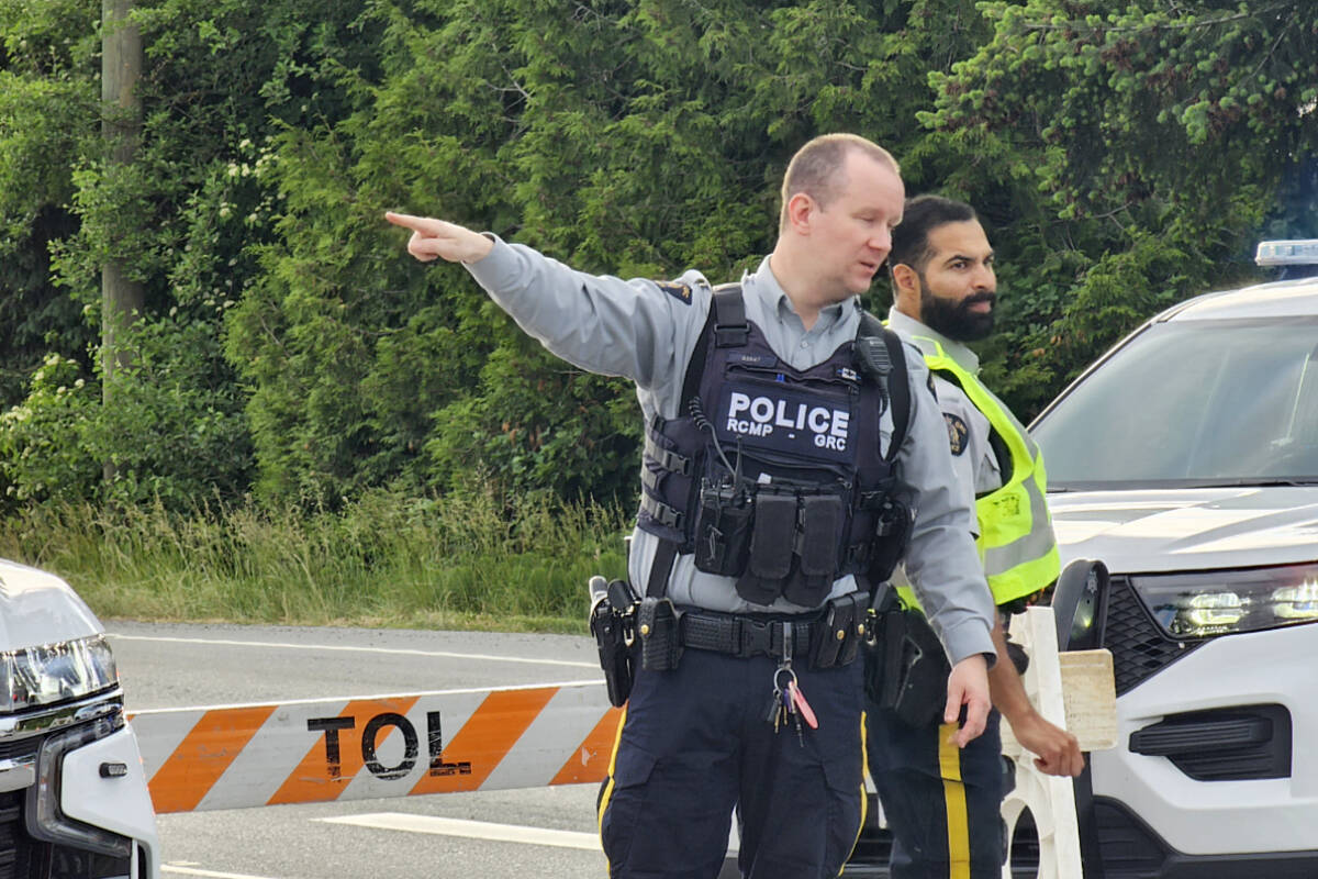 RCMP officers at the scene of a fatal three-vehicle crash on Langley’s 16th Avenue on May 31, 2023. (Dan Ferguson/Langley Advance Times)