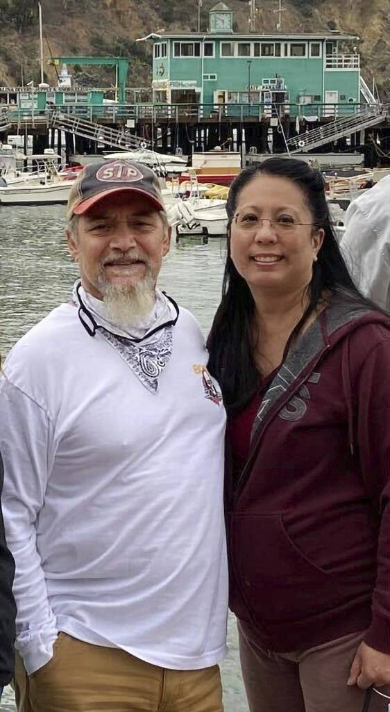 This undated photo provided by James Solis shows Robert Solis, left and his partner Brandi Tyau, right. Robert Solis and Tyau were aboard the charter fishing vessel Awakin when it ran into trouble Sunday in rough seas off the coast of southeast Alaska. The bodies of three of the five people aboard have been found but two people remain missing. Authorities are working to salvage the boat, which was found partially submerged off an island near Sitka, Alaska. Those on the vessel were Solis and Tyau, Tyau’s sister and her partner and the boat captain. (James Solis via AP)