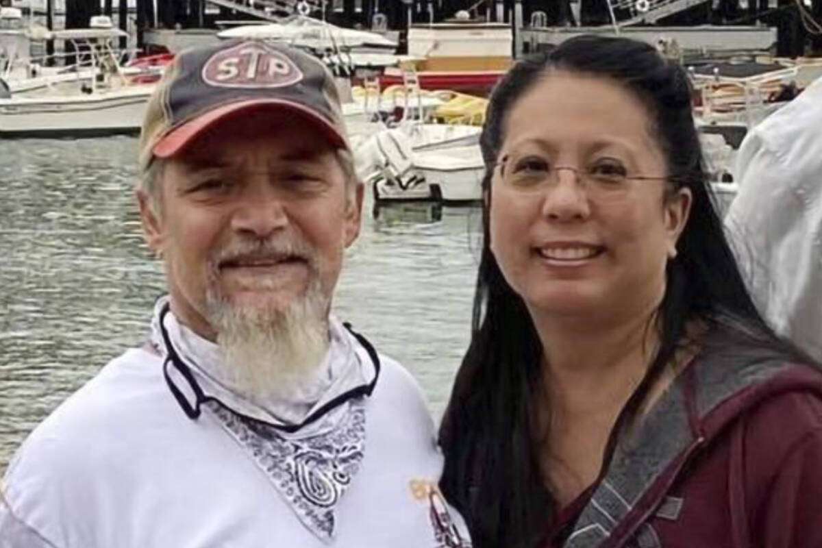 This undated photo provided by James Solis shows Robert Solis, left and his partner Brandi Tyau, right. Robert Solis and Tyau were aboard the charter fishing vessel Awakin when it ran into trouble Sunday in rough seas off the coast of southeast Alaska. The bodies of three of the five people aboard have been found but two people remain missing. Authorities are working to salvage the boat, which was found partially submerged off an island near Sitka, Alaska. Those on the vessel were Solis and Tyau, Tyau’s sister and her partner and the boat captain. (James Solis via AP)