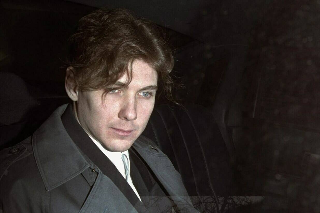 Paul Bernardo sits in the back of a police cruiser as he leaves a hearing in St. Catharines, Ont., April 5, 1994. The federal public safety minister says reports of teen killer and serial rapist Paul Bernardo being transferred to a medium-security prison are “shocking and incomprehensible.” THE CANADIAN PRESS/Frank Gunn