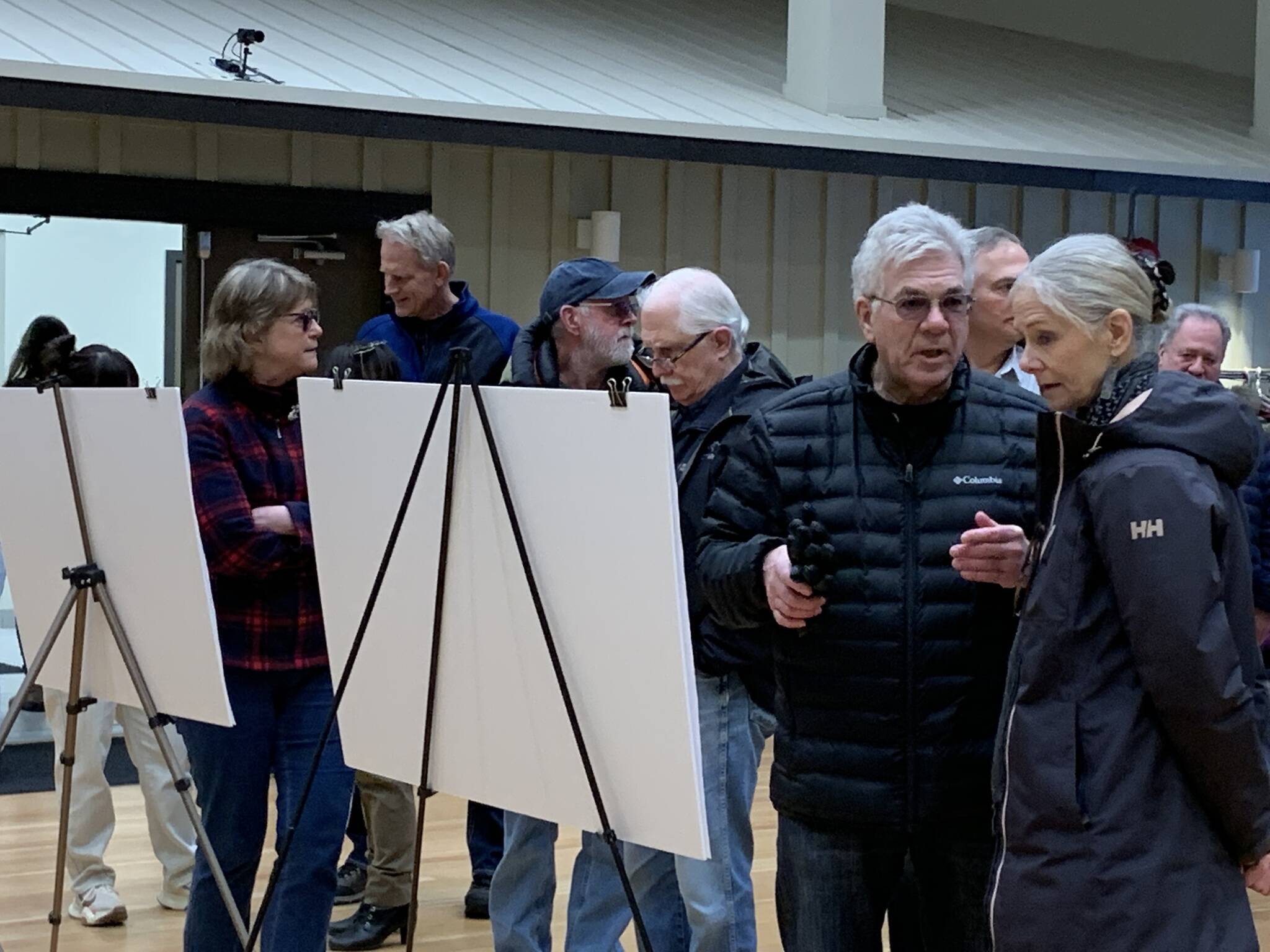 Former councillor John Buckley (second from the right) and dozens of his fellow Harrison Hot Springs residents look over and discuss the updated proposal for development at 511 Lillooet Avenue. Buckley resigned effective immediately on Monday, June 5. (Observer File Photo)