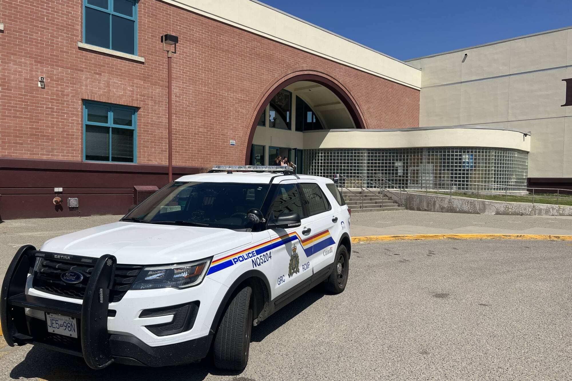 RCMP vehicles were stationed outside Clarence Fulton Secondary School in Vernon after a hold and secure was reportedly activated Friday, June 2, 2023. (Brendan Shykora - Morning Star)
