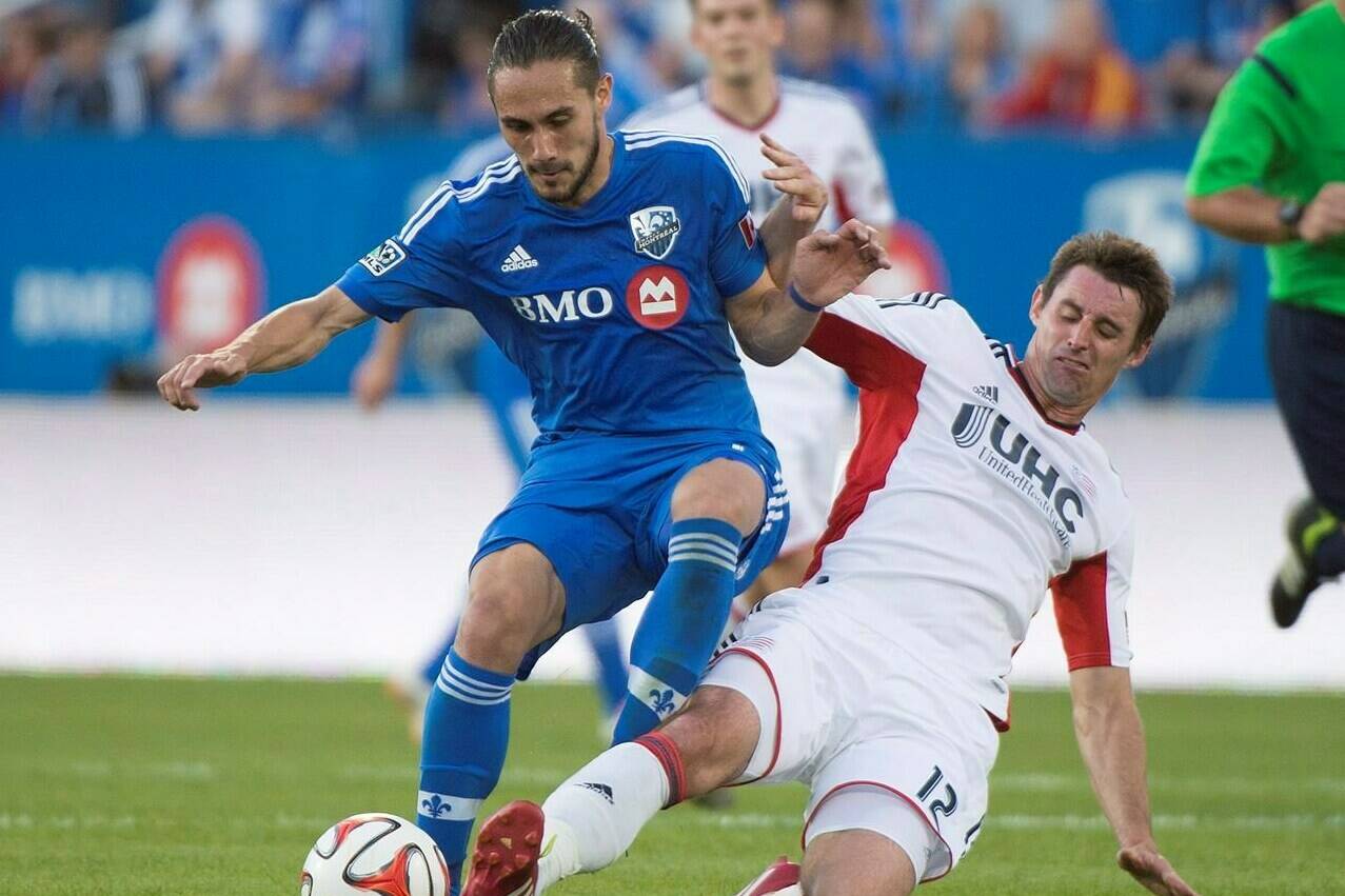Montreal Impact’s Issey Nakajima-Farran, left, battles for the ball against New England Revolution’s Andy Dorman during first half MLS soccer action in Montreal on May 31, 2014. Football has already taken former Canadian international Issey Nakajima-Farran around the globe. The former Toronto FC, CF Montreal and Pacific FC midfielder has played club football in Australia, Cyprus, Denmark, Japan, Malaysia, Singapore and Spain as well as North America. Now newly retired, the 39-year-old Nakajima-Farran is working on his future aboard a boat in Barcelona. It’s his floating home. THE CANADIAN PRESS/Graham Hughes