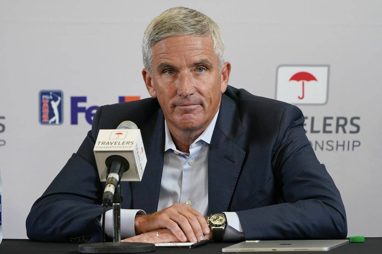 FILE - PGA Tour Commissioner Jay Monahan speaks during a news conference before the start of the Travelers Championship golf tournament at TPC River Highlands, Wednesday, June 22, 2022, in Cromwell, Conn. The most disruptive year in golf ended Tuesday, June 6, 2023, when the PGA Tour and European tour agreed to a merger with Saudi Arabia’s golf interests, creating a commercial operation designed to unify professional golf around the world.(AP Photo/Seth Wenig, File)