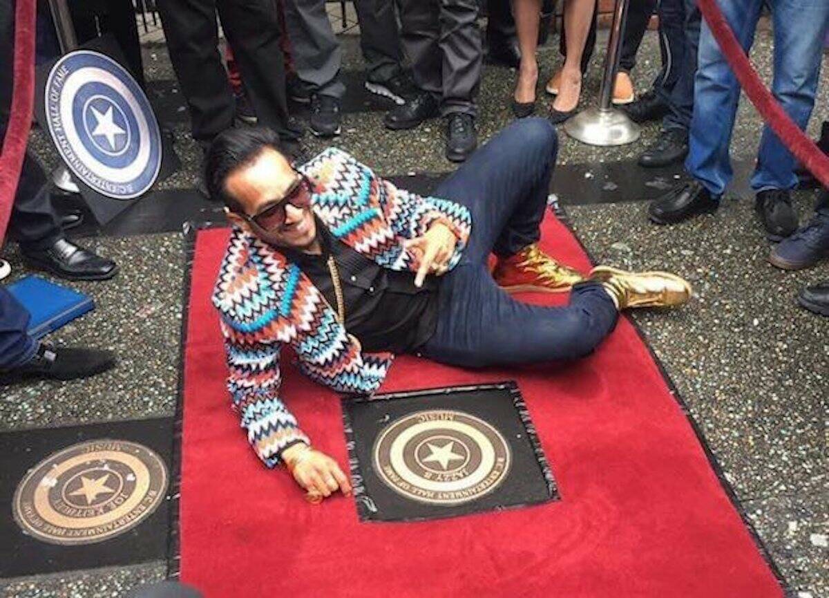Surrey-raised musician Jazzy B with his StarWalk plaque on Granville Street in Vancouver during its unveiling in September 2016. (File photo)