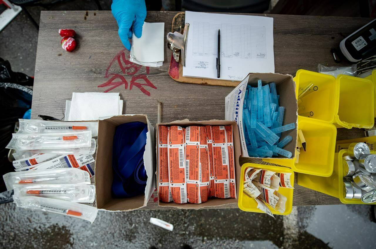 Supplies are seen on a table at an outdoor supervised consumption site in the Downtown Eastside of Vancouver, on Thursday, May 27, 2021. A Vancouver family known for its philanthropy is making a $20 million donation to a British Columbia substance use treatment centre in memory of their adult son and brother who died of a opioid overdose. THE CANADIAN PRESS/Darryl Dyck