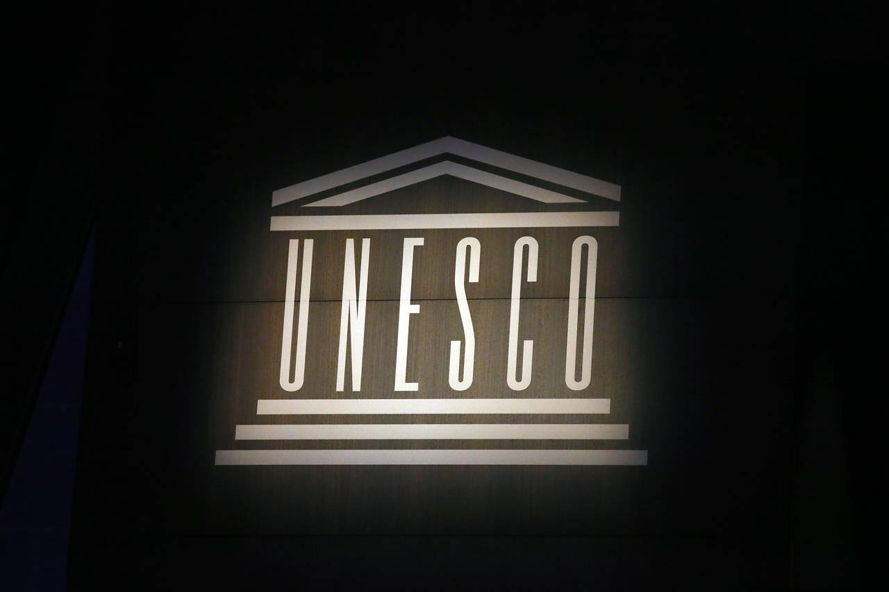 FILE - The logo of the United Nations Educational, Scientific and Cultural Organisation (UNESCO) is seen during the 39th session of the General Conference at the UNESCO headquarters, Oct.31 2017 in Paris. The United States is ready to rejoin the U.N. cultural and scientific agency UNESCO – and pay more than $600 million in back dues — after a decade-long dispute sparked by the organization’s move to include Palestine as a member. (AP Photo/Francois Mori, File)