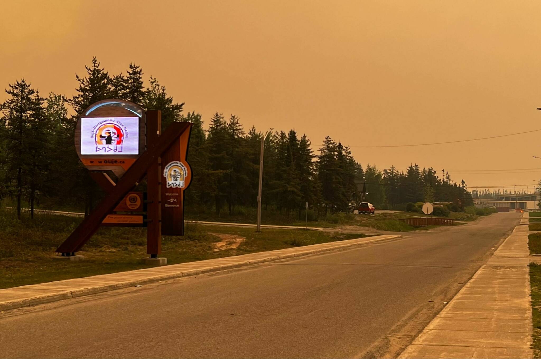Smoke is seen obscuring the sky on the Ouje-Bougoumou Cree Nation, Que., in a June 6, 2023, handout photo. Three First Nations community in northern Quebec was abruptly evacuated last week as an out-of-control wildfire lurched closer to the community. THE CANADIAN PRESS/HO-Deputy Chief Lance Cooper