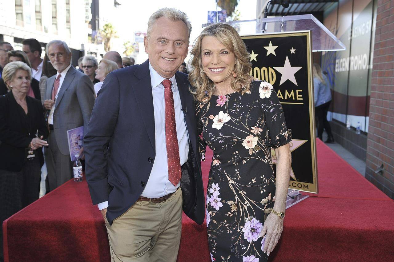 FILE - Pat Sajak, left, and Vanna White, from “Wheel of Fortune,” attend a ceremony honoring Harry Friedman with a star on the Hollywood Walk of Fame on Nov. 1, 2019, in Los Angeles. Sajak is taking one last spin on “Wheel of Fortune,” announcing Monday, June 12, 2023, that its upcoming season will be his last as host. (Photo by Richard Shotwell/Invision/AP, File)