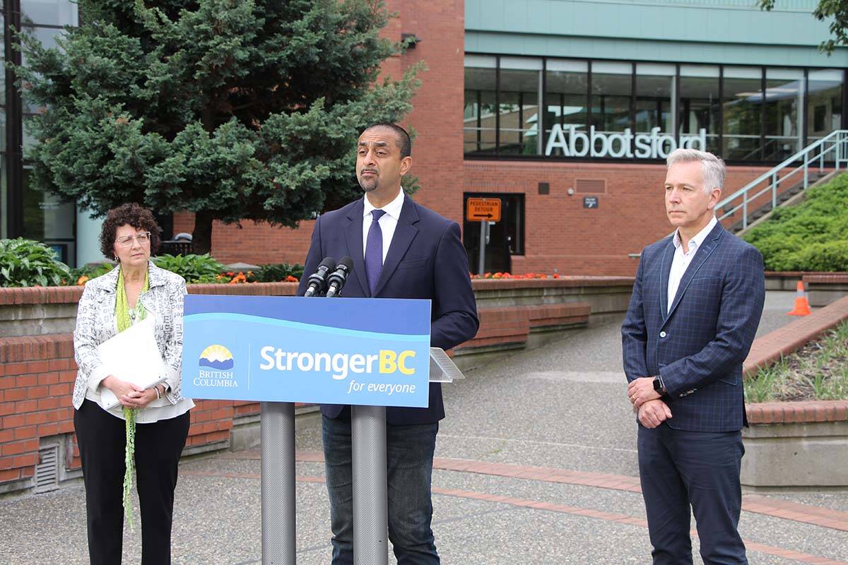Housing Minister Ravi Kahlon (middle) announces plans for the Lonzo Road homeless camp in Abbotsford on Tuesday morning (June 13) outside Abbotsford city hall. He is joined by Abbotsford-Mission MLA Pam Alexis and Mayor Ross Siemens. Kahlon also used the occasion to announce Abbotsford as the first of five communities where specialized regional teams will step into action when homeless camps spring up. (Vikki Hopes/Abbotsford News)