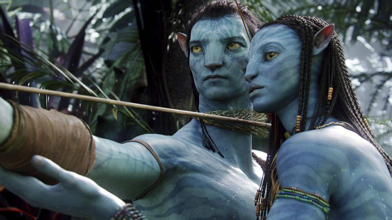 FILE - This image released by 20th Century Fox shows the characters Neytiri, right, and Jake in a scene from the 2009 movie "Avatar." The sequel, “Avatar: The Way of Water” may have finally arrived in theaters in 2022, but that long parade of “Avatar” delays isn’t done, yet. The Walt Disney Co. on Tuesday pushed the release of “Avatar 3” a year, bumping it from December 2024 to December 2025. (AP Photo/20th Century Fox, File)