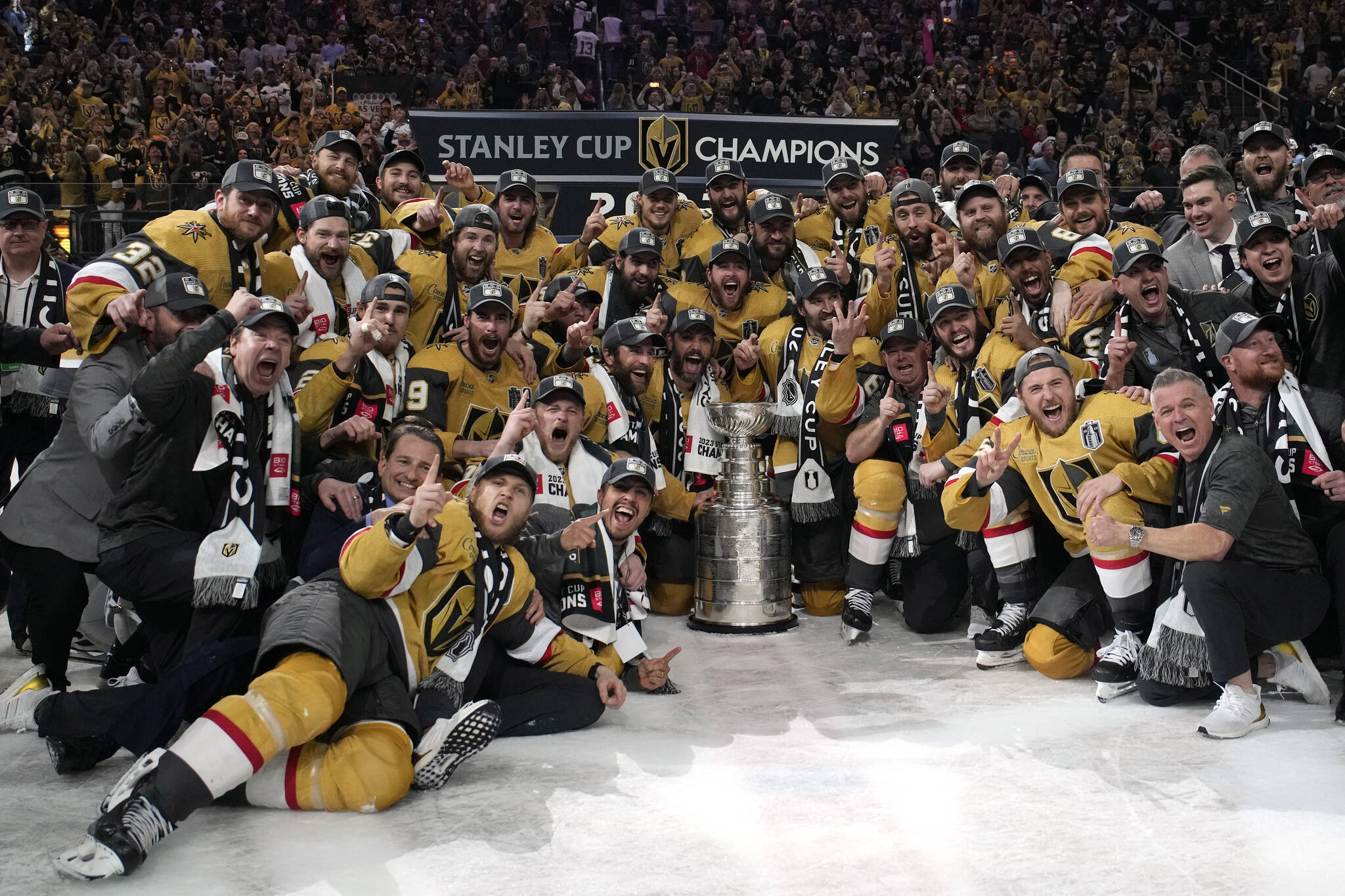 Members of the Vegas Golden Knights pose with the Stanley Cup after the Knights defeated the Florida Panthers 9-3 in Game 5 of the NHL hockey Stanley Cup Finals Tuesday, June 13, 2023, in Las Vegas. The Knights won the series 4-1. (AP Photo/John Locher)