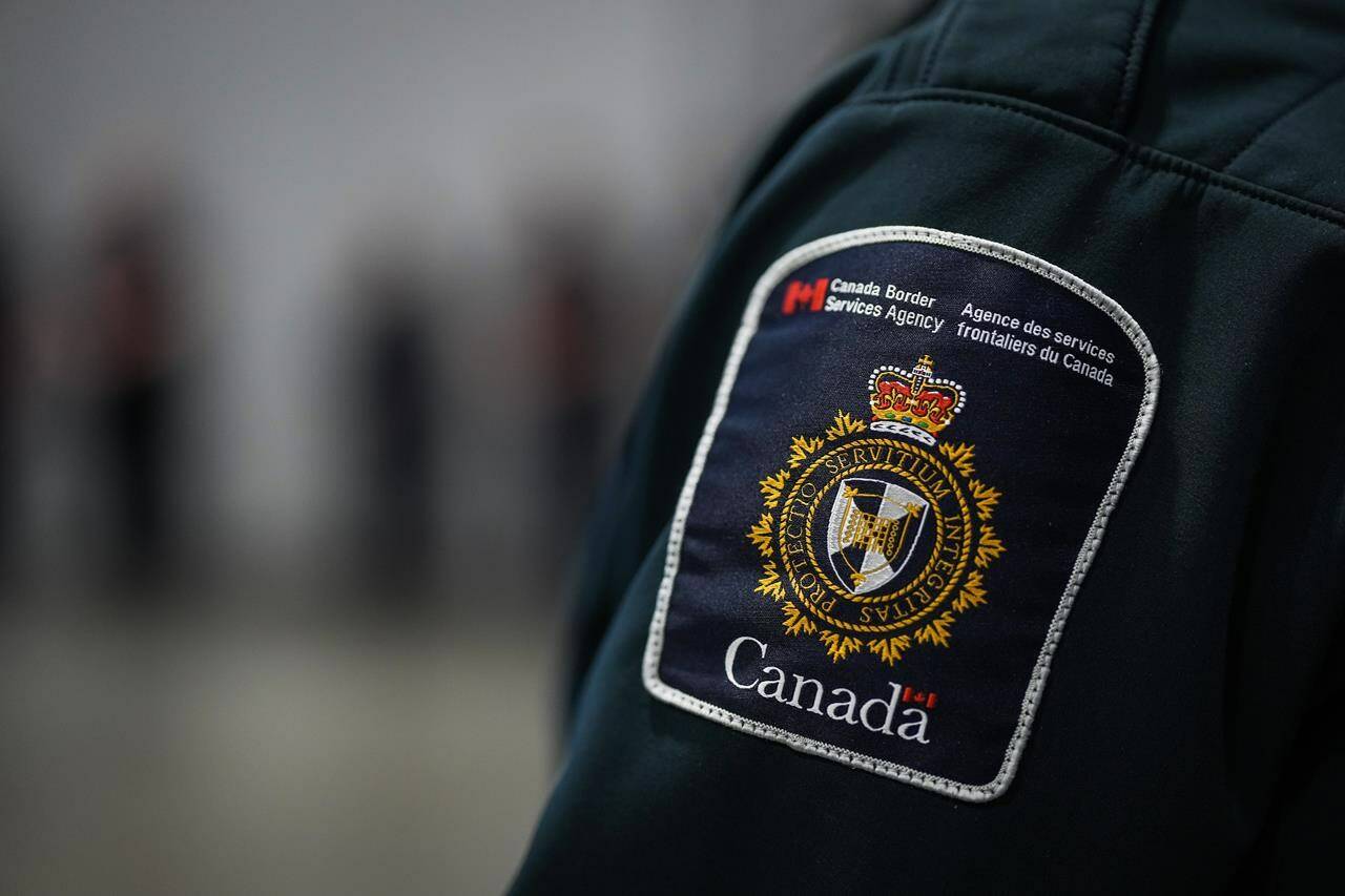 A patch is seen on the shoulder of a Canada Border Services Agency officer’s uniform in Tsawwassen, B.C., Friday, Dec. 16, 2022. THE CANADIAN PRESS/Darryl Dyck
