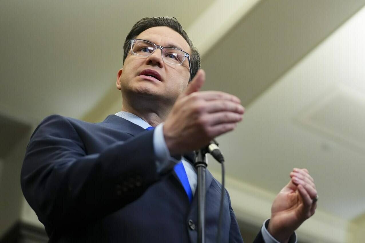 Conservative Leader Pierre Poilievre speaks to reporters in the foyer of the House of Commons on Parliament Hill in Ottawa on Thursday, June 8, 2023. Poilievre says Marco Mendicinio should resign or be fired over his office’s handling of knowledge that Paul Bernardo was being transferred to a medium-security prison. THE CANADIAN PRESS/Sean Kilpatrick