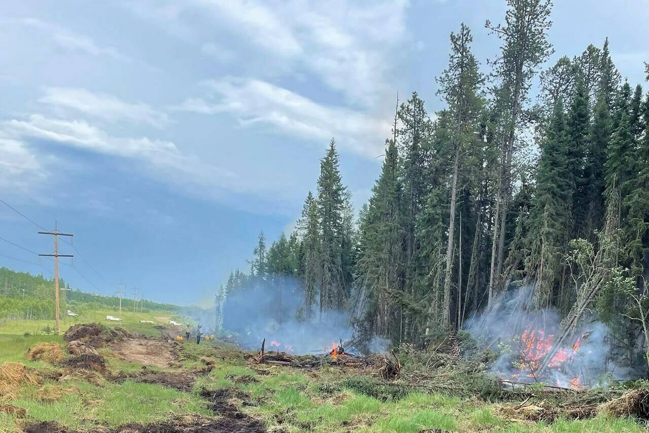Crews work on a controlled burn near Edson, Alta., in a Tuesday, June 13, 2023, handout photo. THE CANADIAN PRESS/HO-Government of Alberta Fire Service