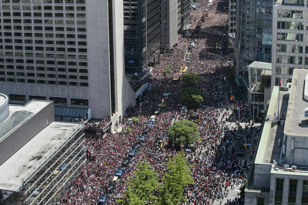 Statistics Canada says the country’s population has reached more than 40 million. Fans cheer during the Raptors Championship parade in Toronto on Monday, June 17, 2019. THE CANADIAN PRESS/Andrew Lahodynskyj