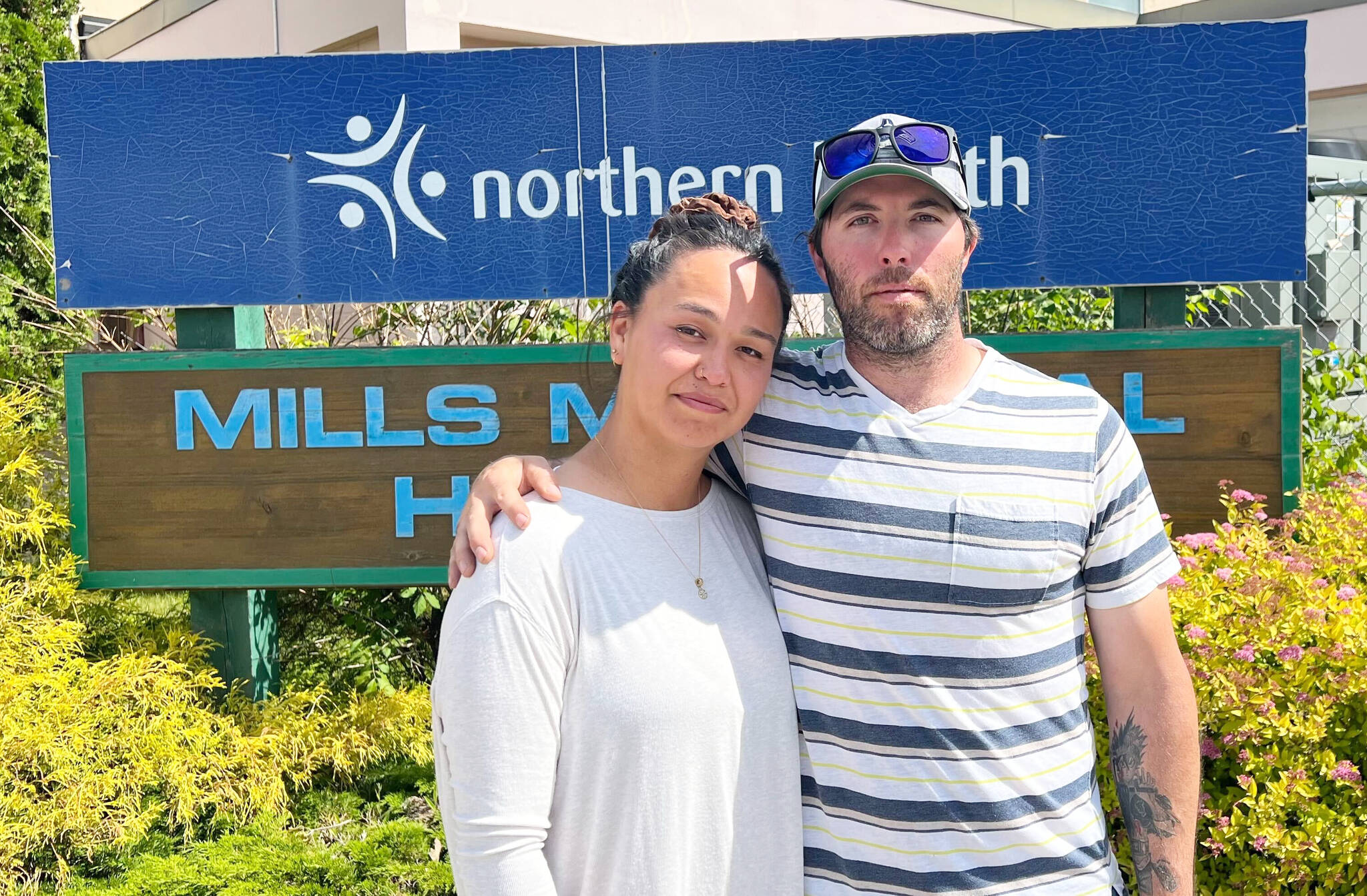 Terrace couple Lisa Seymour and Christopher England stand outside Mills Memorial Hospital. The couple is speaking out against Northern Health’s policy prohibiting guests, including partners, from being present during ultrasound scans. (Viktor Elias/Terrace Standard)