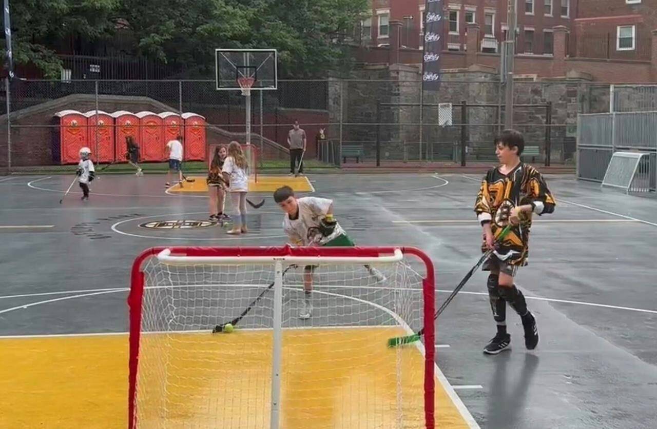 Kids play ball hockey at an NHL Street event in Boston, Mass., on Saturday, June 17, 2023. The league launched a street hockey program earlier this year aimed at getting more people interested in the sport. (AP Photo/Jimmy Golen)