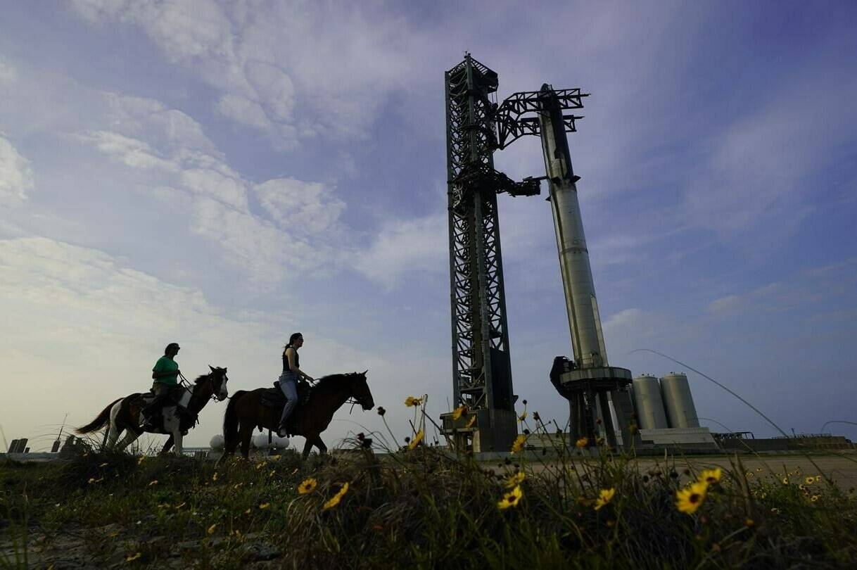 FILE - NASA astronaut Sunita Williams, left, and Haley Esparza, right, ride on a horse as they visit SpaceX’s Starship as it is readied for launch at Starbase in Boca Chica, Texas, on April 19, 2023. The world is a stressful, sometimes lonely place. “It wasn’t supposed to be this way” is a phrase you hear a lot these days. But what if things could turn out another way? What if, somewhere, they had? Enter the realm of the multiverse and alternate realities, popular culture’s wildly glorified canvas — and a repository for the ache and longing of living in an uncertain era. (AP Photo/Eric Gay, File)