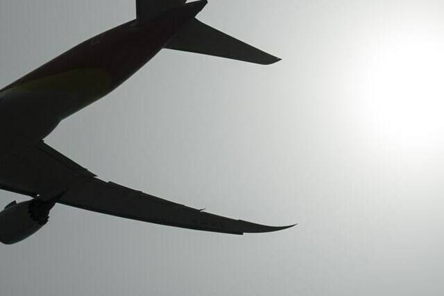 A plane is silhouetted as it takes off from Vancouver International Airport in Richmond, B.C., Monday, May 13, 2019. Trip cancellation insurance covers you or other passengers in your family who are ill and can’t fly, as well as a variety of other unlikely-but-expensive possibilities. THE CANADIAN PRESS/Jonathan Hayward