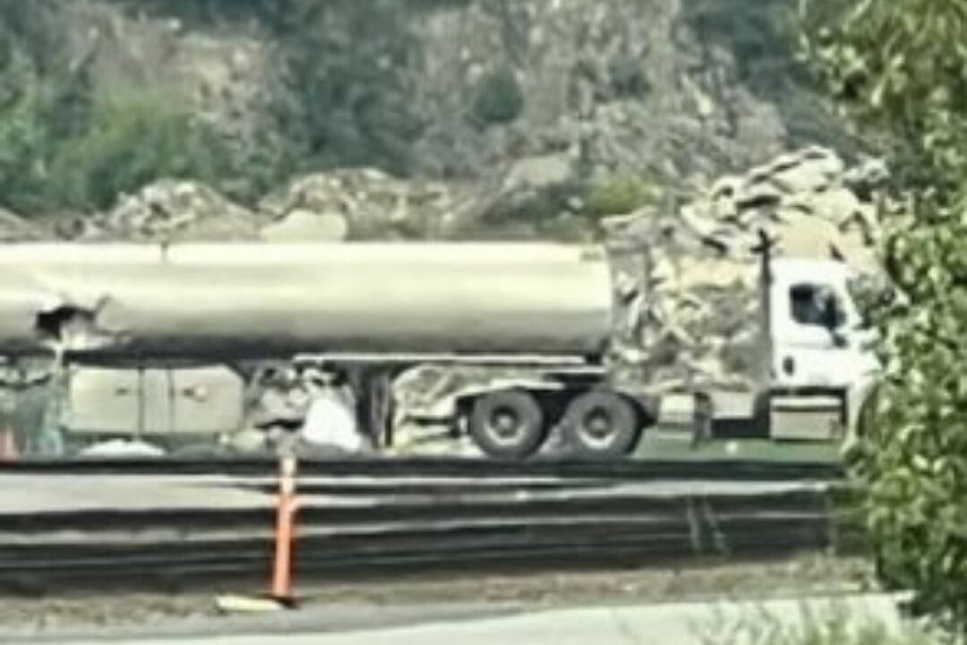 A trimac fuel tanker was clipped by a Canadian Pacific Kansas City Rail train on Thurs. June 15. According to the B.C. Ministry of Environment and Climate Change, up to 25,000 litres of diesel have been spilled near Golden because of the incident. (Photo courtesy of u/Nemesis141 via Reddit.)