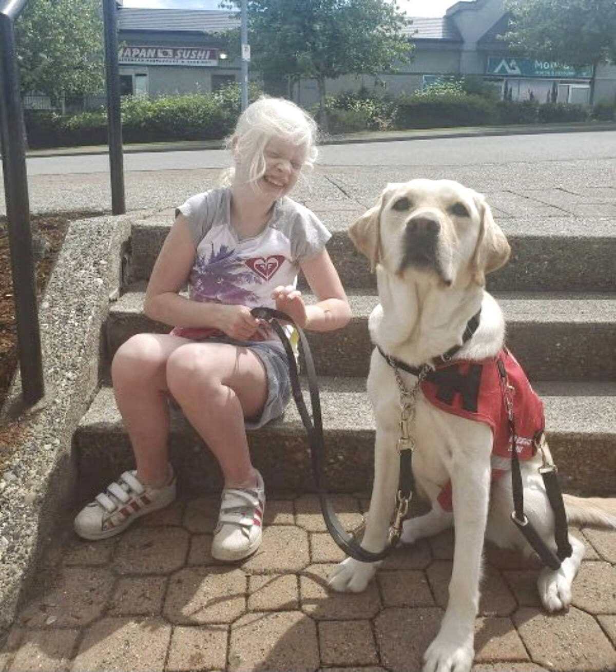 Sophia, seen here with her service dog Fresca, will get to go with her fellow Grade 6 students on a field trip to the water park at Cultus Lake after the Langley School District rescinded a decision excluding the special needs student citing ‘WorkSafe’ issues. (Special to Langley Advance Times)