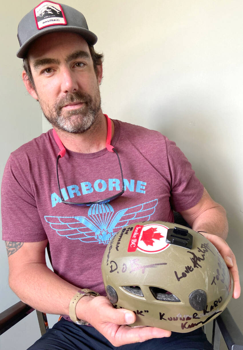 James Sails, 37, with his mountaineering helmet signed by his Mount Everest teammates. (Kevin Laird - Sooke News Mirror)