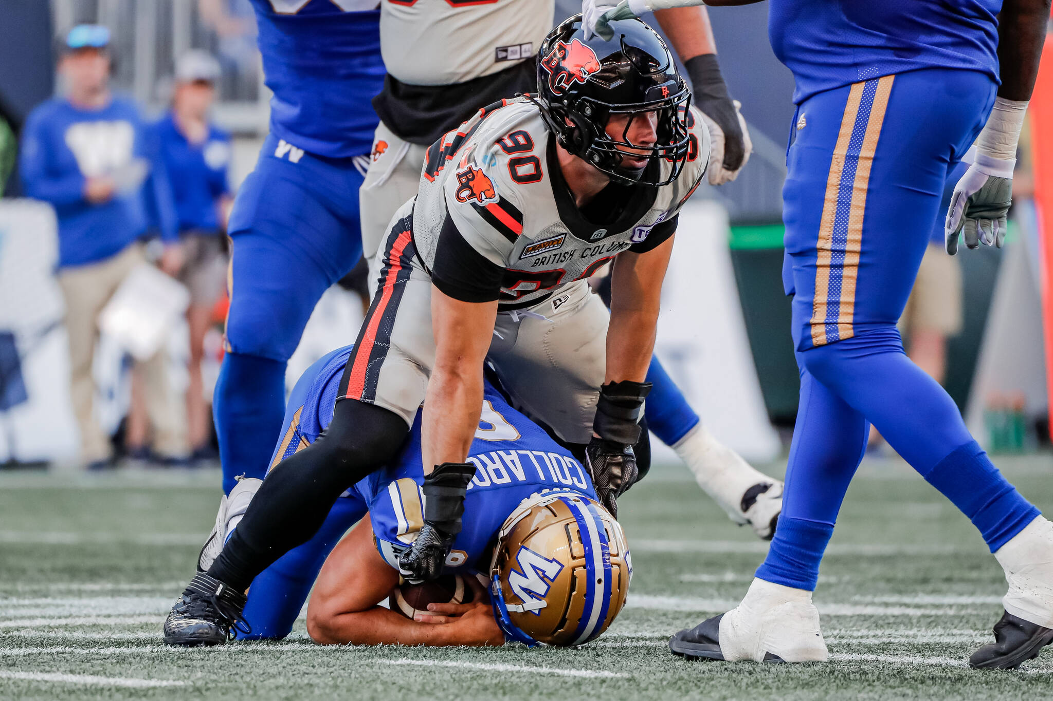 Lions defensive end Mathieu Betts records one of his three sacks of Bombers quarterback Zach Collaros during B.C.’s 30-6 victory in Winnipeg on Thursday night. Photo courtesy of Steven Chang, B.C. Lions