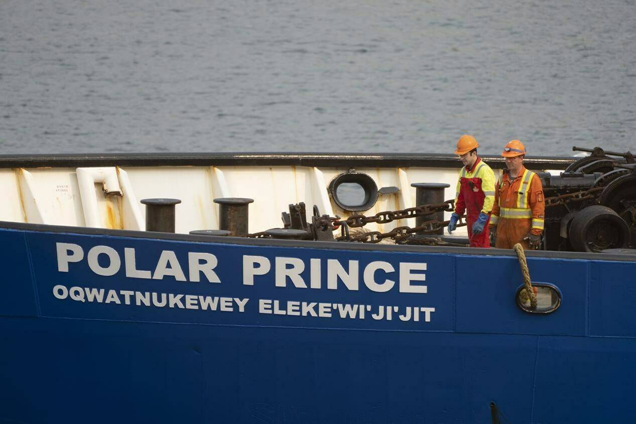 Crew members of the Polar Prince prepare to dock the ship as it arrives at the Coast Guard wharf, Saturday, June 24, 2023 in St. John’s, Nfld. THE CANADIAN PRESS/Adrian Wyld