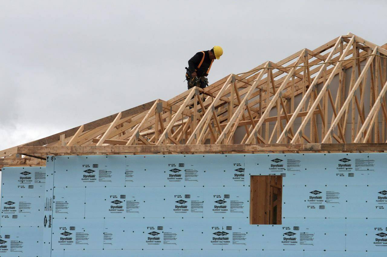 A construction worker works on a house in a new housing development in Oakville, Ont., Friday, April 29. 2011. Calls for co-ordinated action across levels of government to address Canada’s housing crisis are growing as affordability deteriorates and the country risks falling even further behind on building more homes. THE CANADIAN PRESS/Richard Buchan