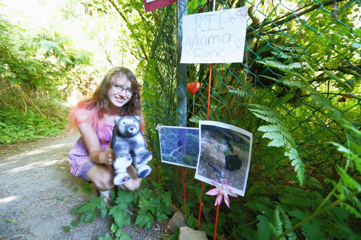 Alaina Miller set up a memorial near Thetis Lake Regional Park for a mother bear euthanized by Conservation Officers Friday (June 23) over concerns it posed a public safety risk. A group of neighbours are now calling for changes in the community to prevent another incident like this. (Justin Samanski-Langille/News Staff)