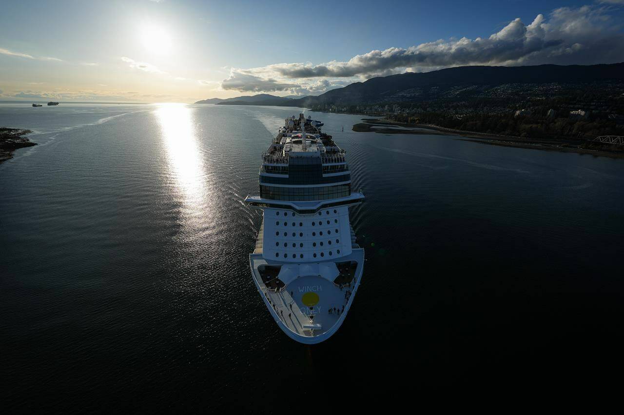 The Norwegian Cruise Line ship Norwegian Bliss passes under the Lions Gate Bridge upon arrival in Vancouver, on Thursday, April 13, 2023. A possible strike by British Columbia port workers will not disrupt cruise ships docked in Vancouver, Prince Rupert or Vancouver Island, employers say. THE CANADIAN PRESS/Darryl Dyck
