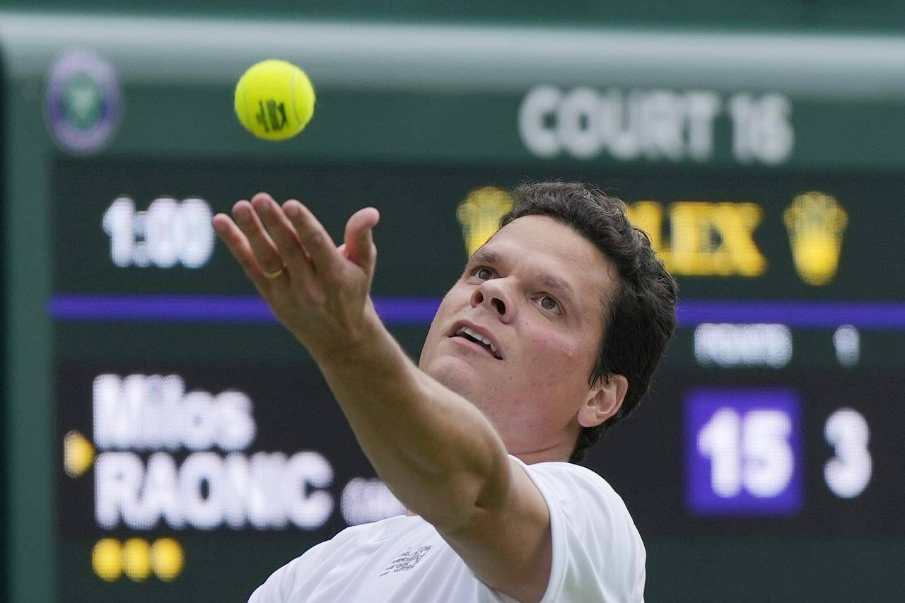 Canada’s Milos Raonic serves to Austria’s Dennis Novak during the men’s singles match on day three of the Wimbledon tennis championships in London, Wednesday, July 5, 2023. THE CANADIAN PRESS/AP/Alastair Grant