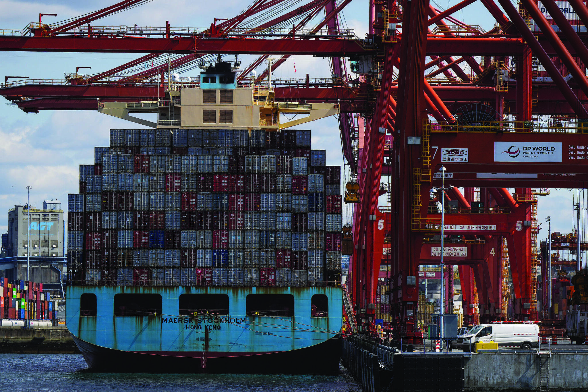 Cargo containers are unloaded from the Maersk Stockholm ship with gantry cranes while docked at port in Vancouver. (Black Press Media File Photo)