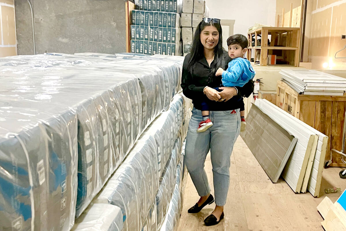 Simi Rajput, co-founder and CEO of Green Giantz, and her son in the warehouse full of packaged biodegradable briefs. (Special to Langley Advance Times)