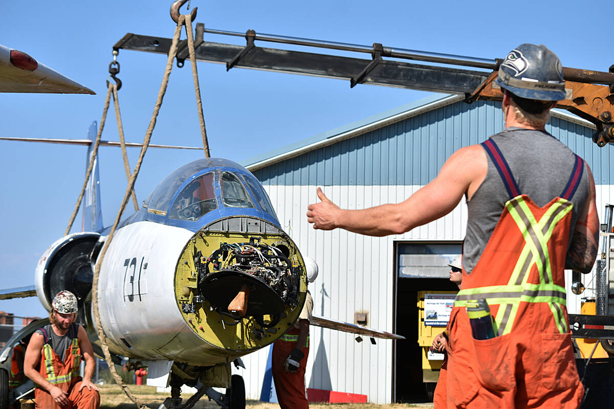 A crew prepares to lift the iconic F-104 Starfighter for its move from the Comox Heritage Airpark to the B.C. Aviation Museum in Victoria. (Olivier Laurin / Comox Valley Record)