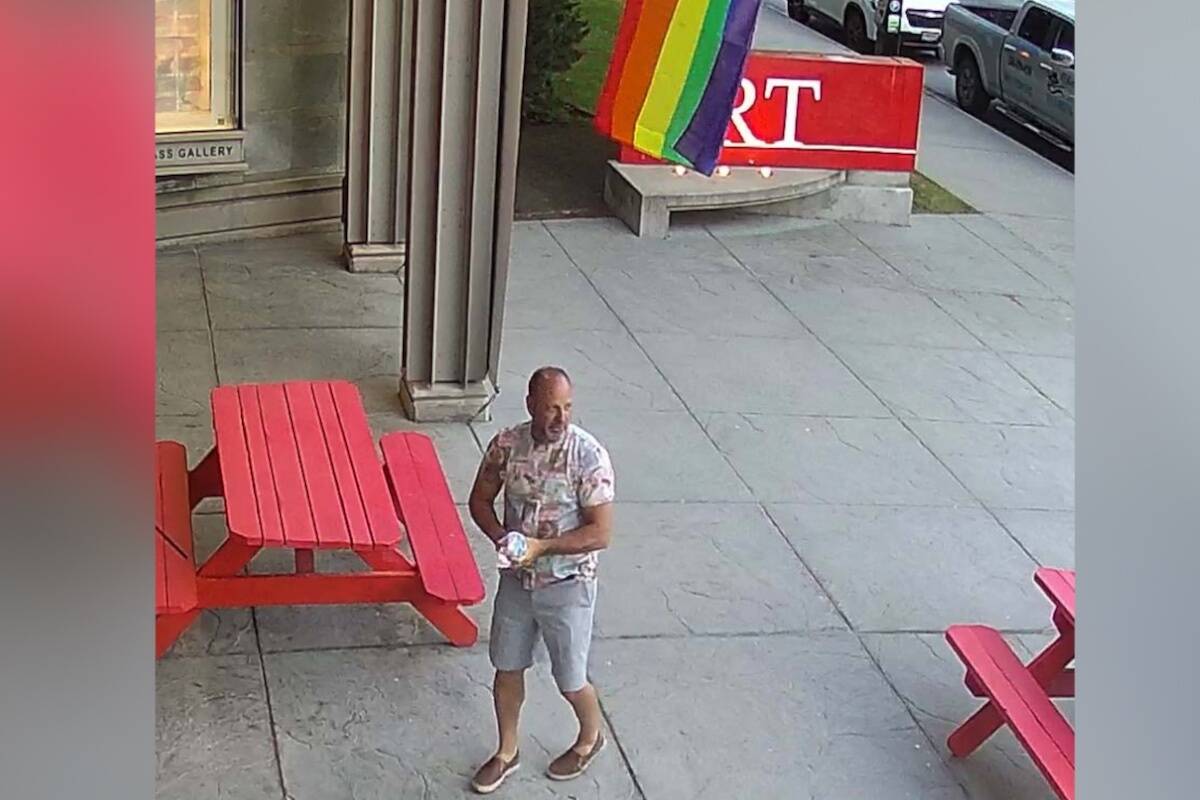 A man ripped down the trans flag in front of the Kelowna Art Gallery on June 2. (Kelowna RCMP/Submitted)
 A man ripped down the trans flag in front of the Kelowna Art Gallery on June 2. (Kelowna RCMP/Submitted)