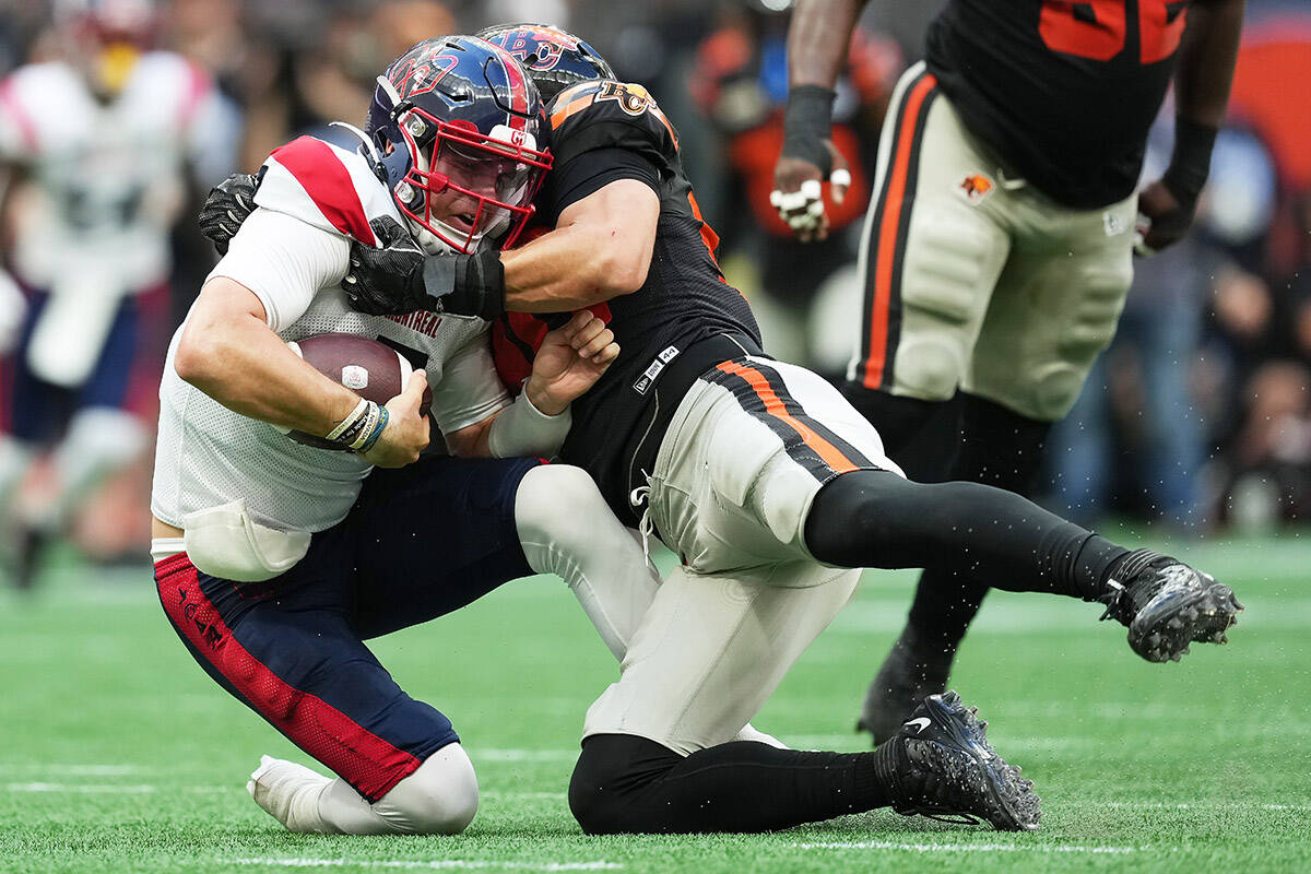 Montreal Alouettes quarterback Cody Fajardo, left, is sacked by B.C. Lions’ Mathieu Betts during the first half of a CFL football game, in Vancouver, B.C., Sunday, July 9, 2023. THE CANADIAN PRESS/Darryl Dyck