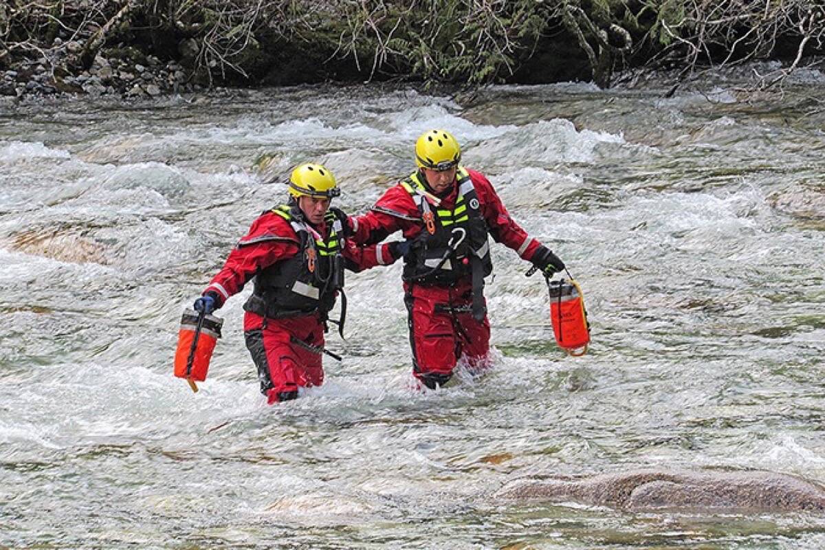 Rescue crews in Gold Creek. (The News files)