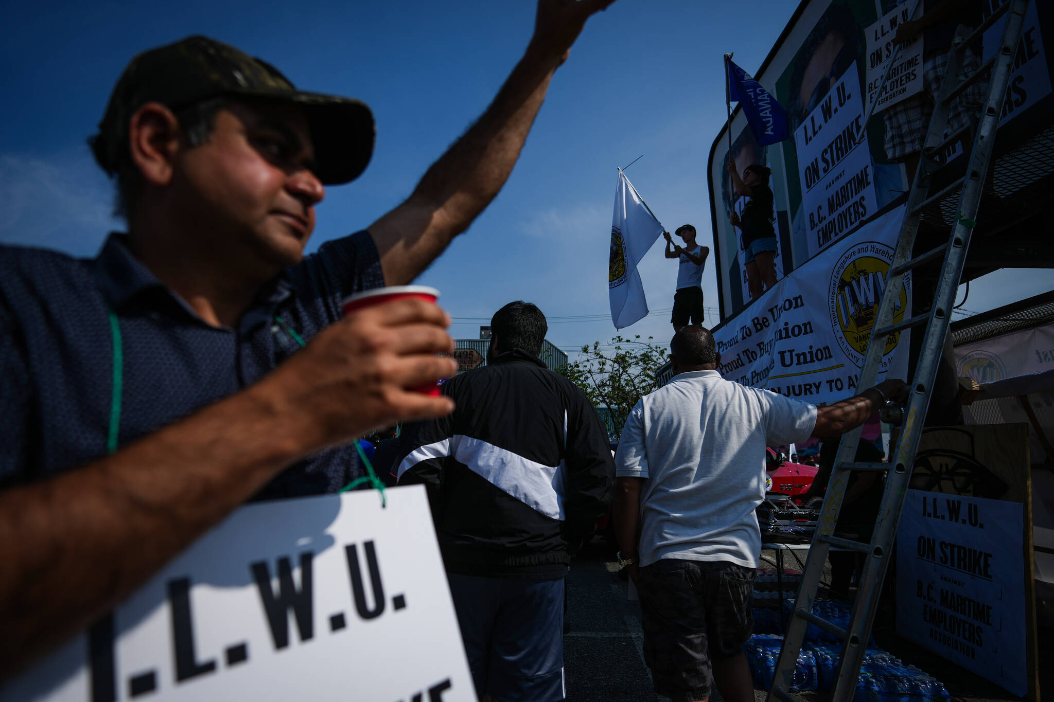 Striking port workers from the International Longshore and Warehouse Union Canada attend a rally, in Vancouver, on Thursday, July 6, 2023. THE CANADIAN PRESS/Darryl Dyck