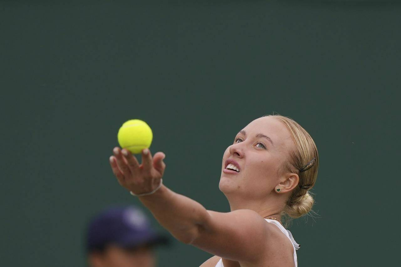 Russia’s Anastasia Potapova serves to Russia’s Mirra Andreeva during the women’s singles match on day seven of the Wimbledon tennis championships in London, Sunday, July 9, 2023. (AP Photo/Alberto Pezzali)
